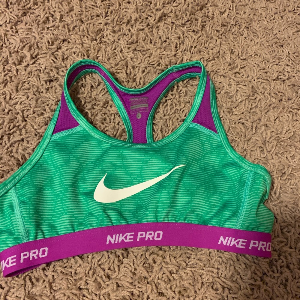 green and pink low support nike sports bra